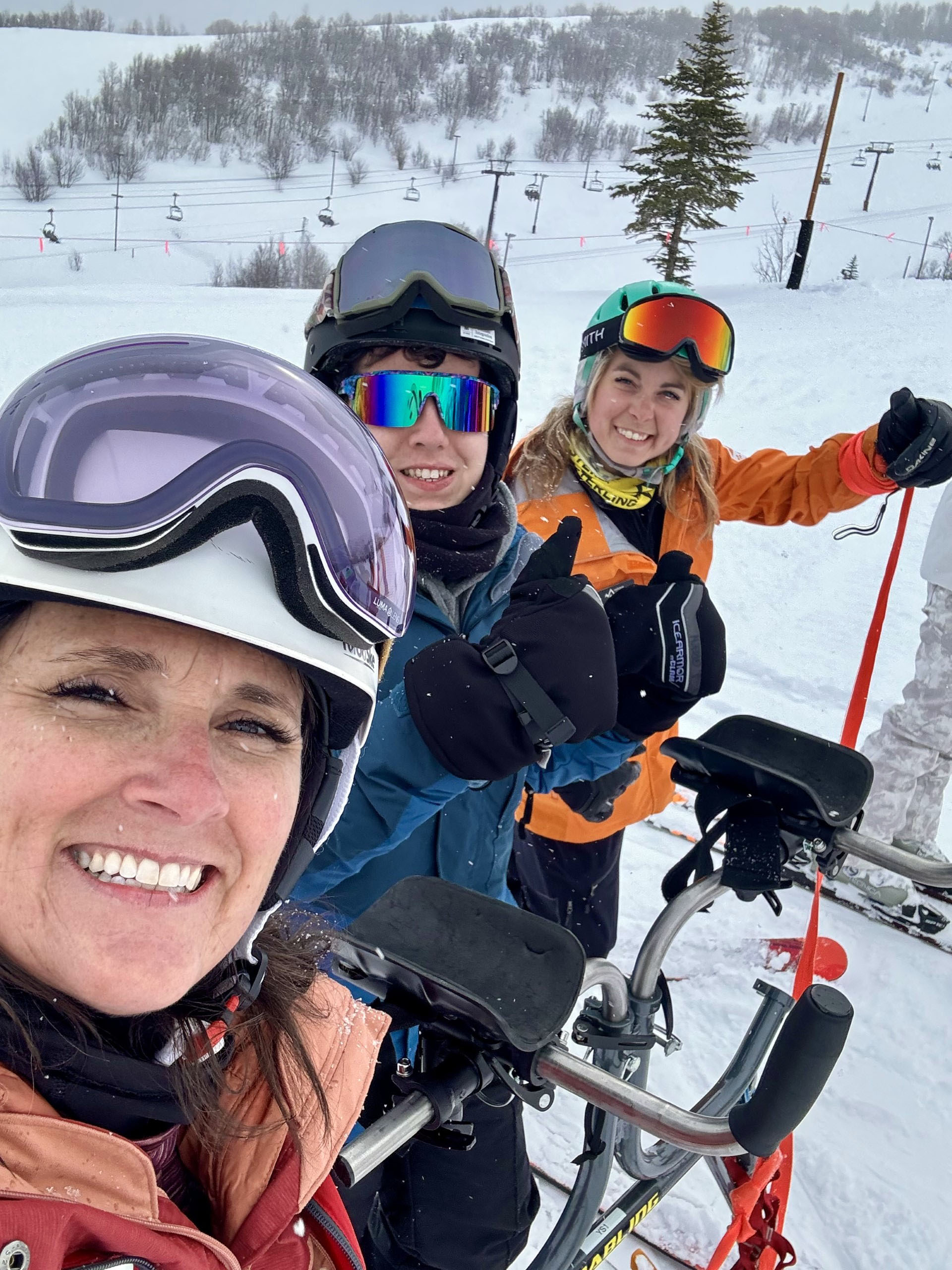 Emma, Kelly, and Jack on a snowy mountain 