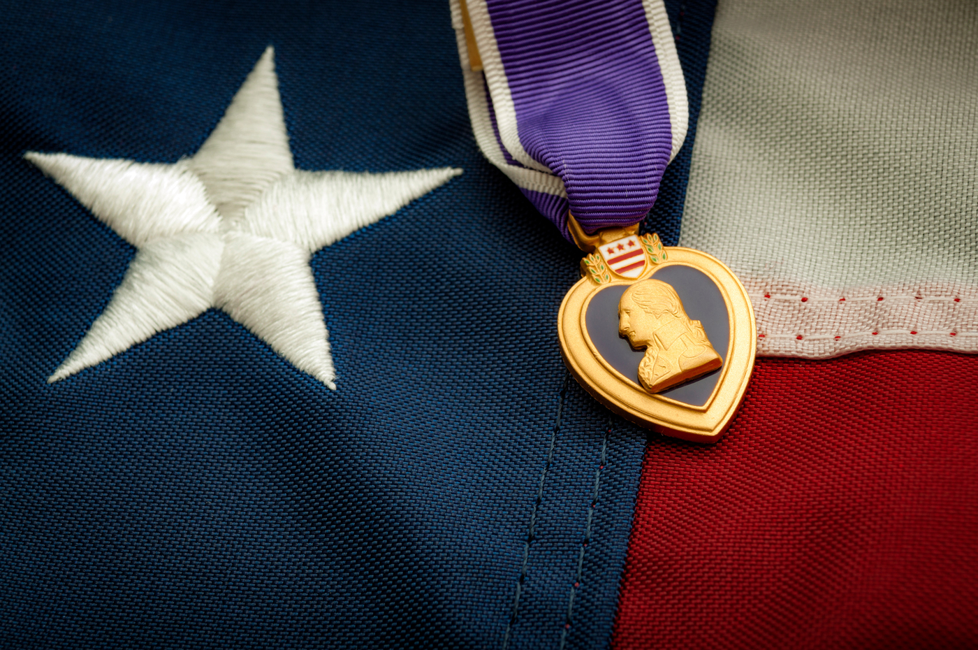 Purple Heart placed on an American flag