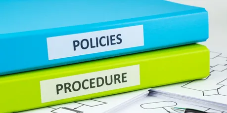 Binders labeled: policies and procedure