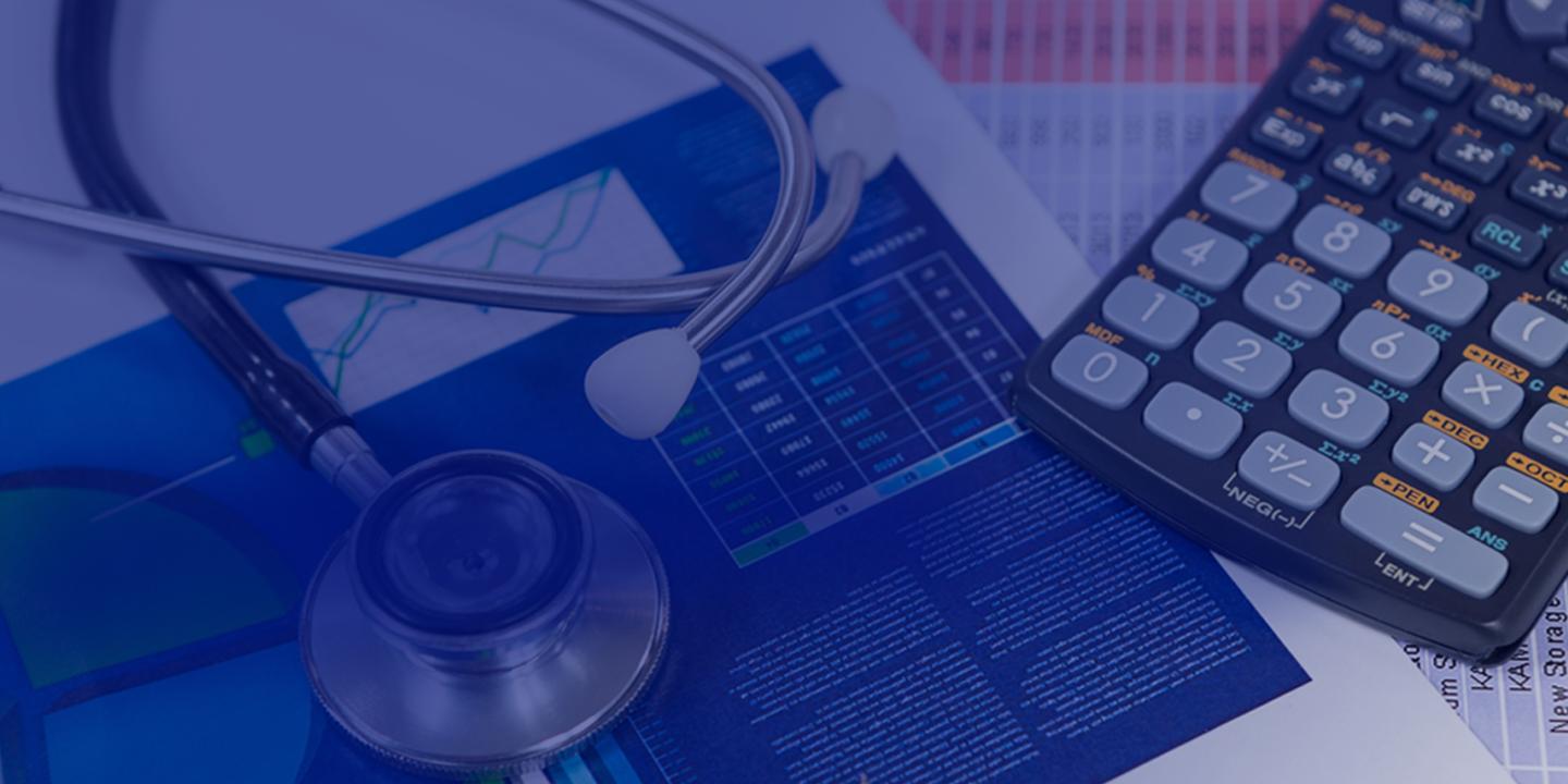 A calculator, stethoscope, and data charts