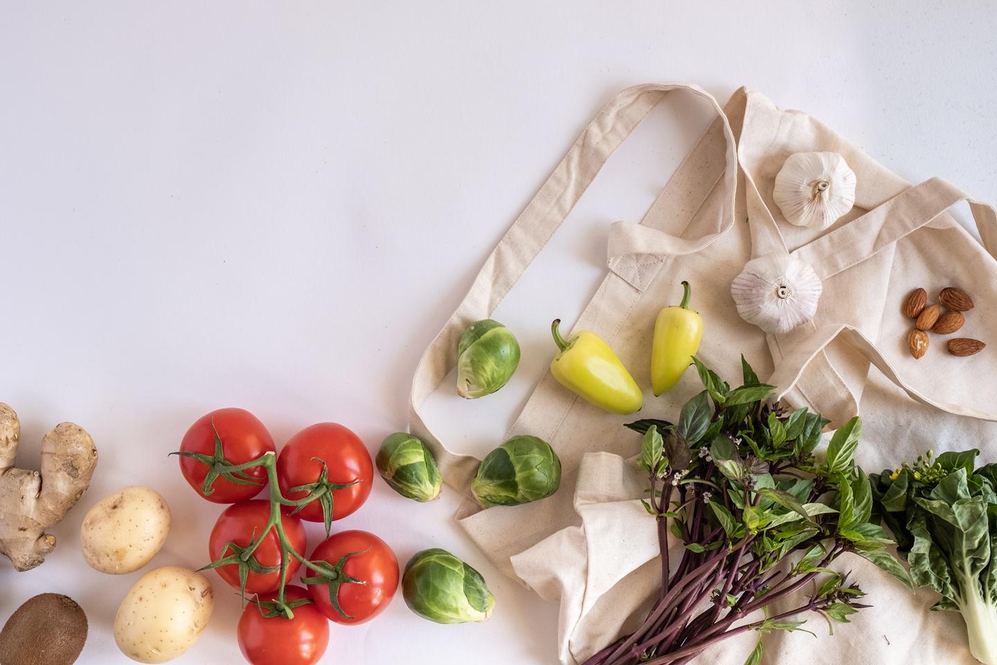 aerial view of vegetables and herbs on top of an apron